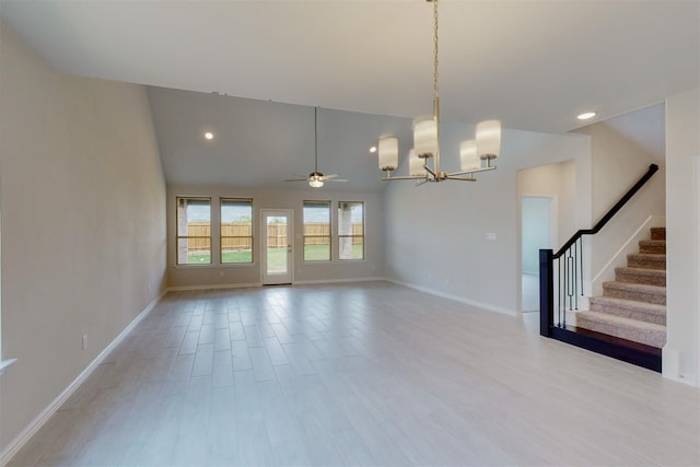 unfurnished living room featuring baseboards, lofted ceiling, recessed lighting, stairs, and light wood-style floors