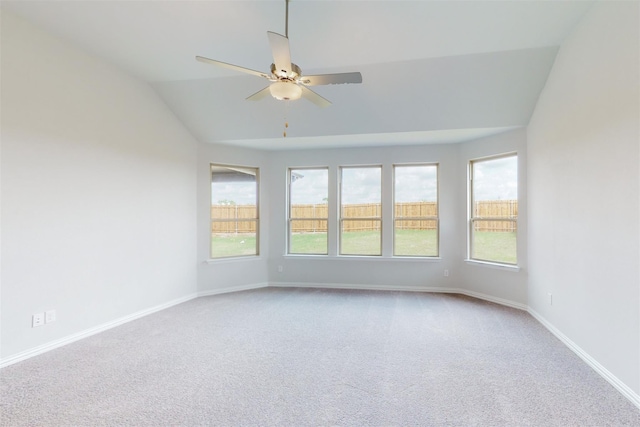 spare room featuring carpet, baseboards, and ceiling fan