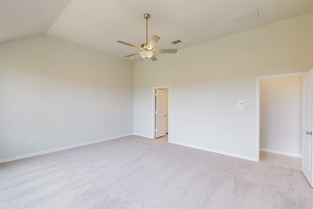 unfurnished room featuring baseboards, a ceiling fan, visible vents, and light carpet