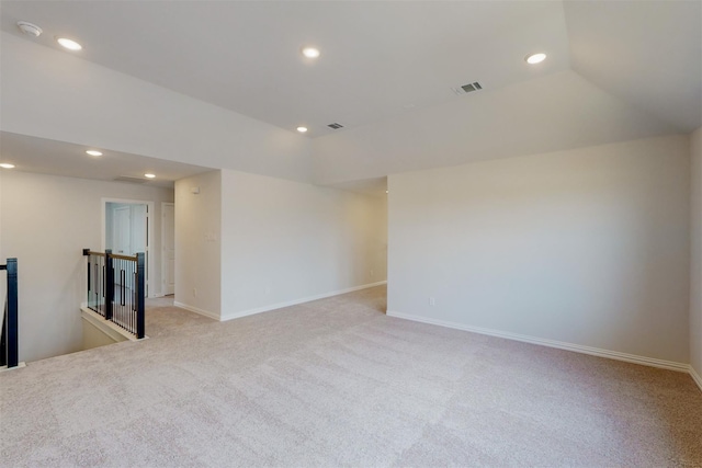 unfurnished room with light carpet, visible vents, recessed lighting, and lofted ceiling