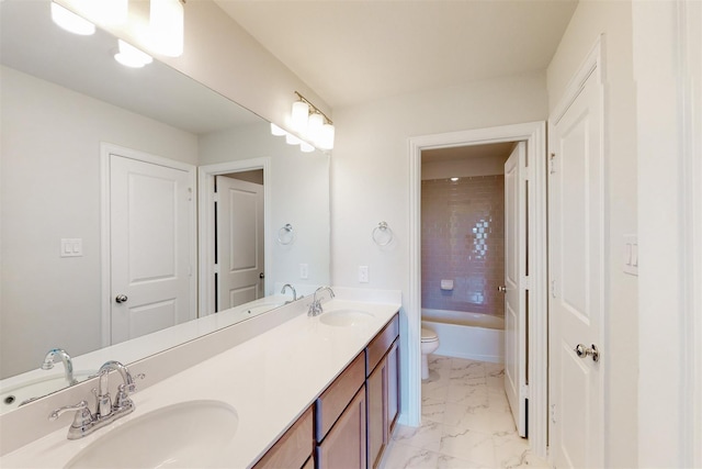 full bathroom with a sink, toilet, marble finish floor, and double vanity