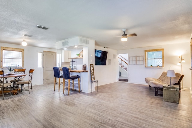 kitchen with visible vents and wood finished floors