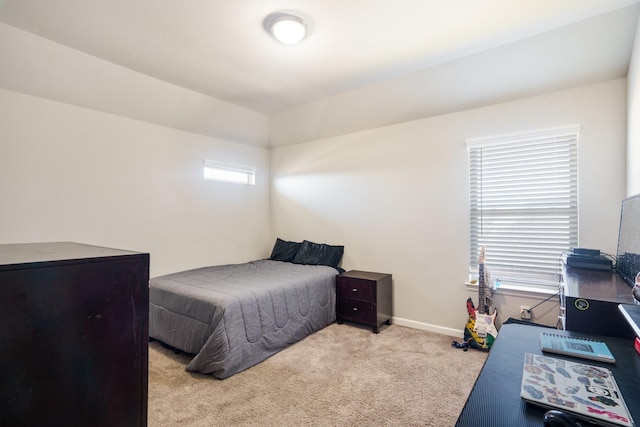 bedroom featuring baseboards and carpet flooring