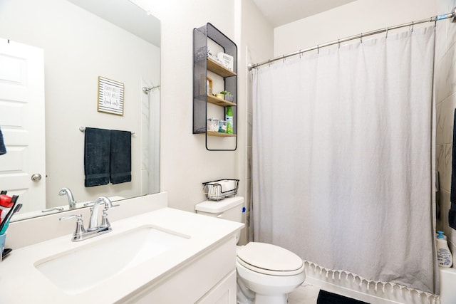 bathroom featuring curtained shower, toilet, and vanity