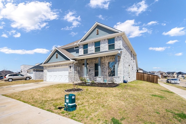 view of front facade featuring a front lawn, fence, concrete driveway, an attached garage, and brick siding