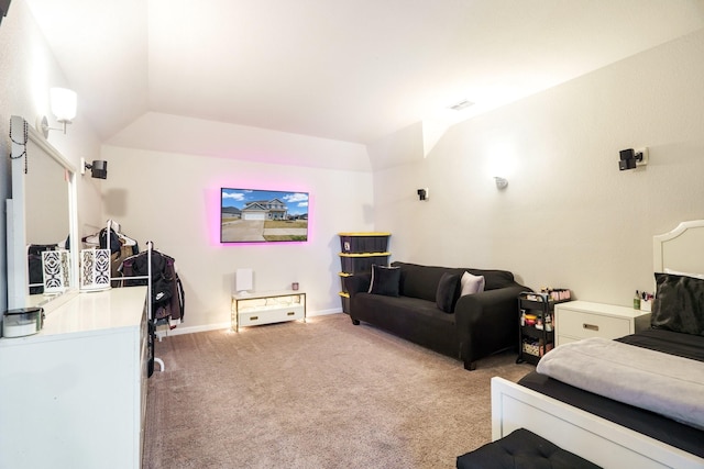 bedroom featuring light colored carpet and baseboards