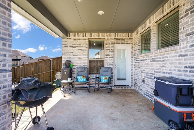 view of patio featuring fence