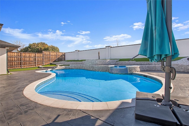 view of pool featuring a patio area, a fenced backyard, a fenced in pool, and an in ground hot tub