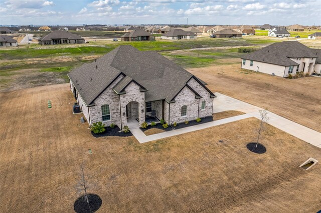birds eye view of property with a residential view