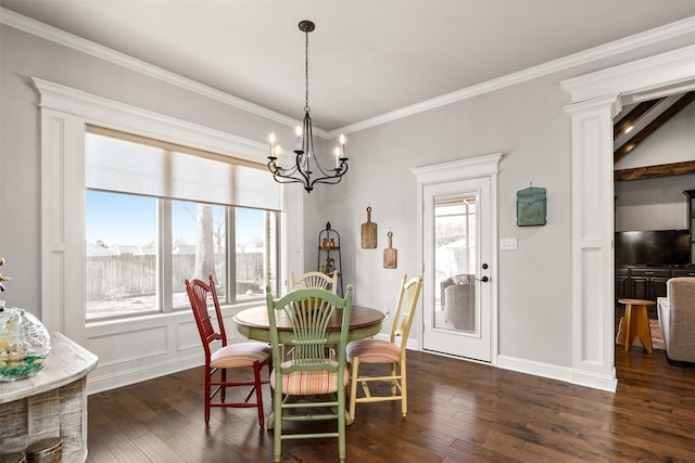 dining room featuring a notable chandelier, a healthy amount of sunlight, ornamental molding, and dark wood-style flooring