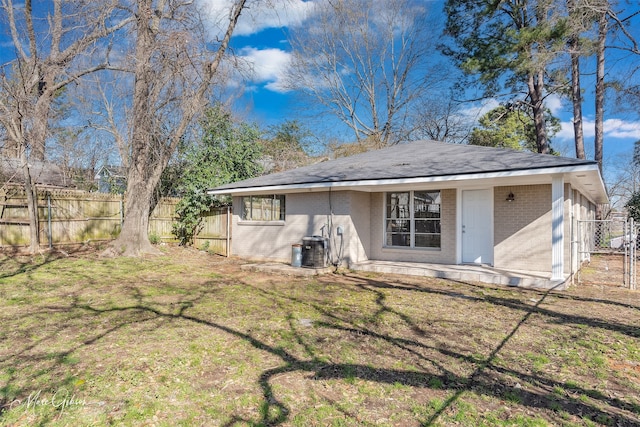 813 Dalzell St, Shreveport, LA 71104 - rear view of property featuring brick siding