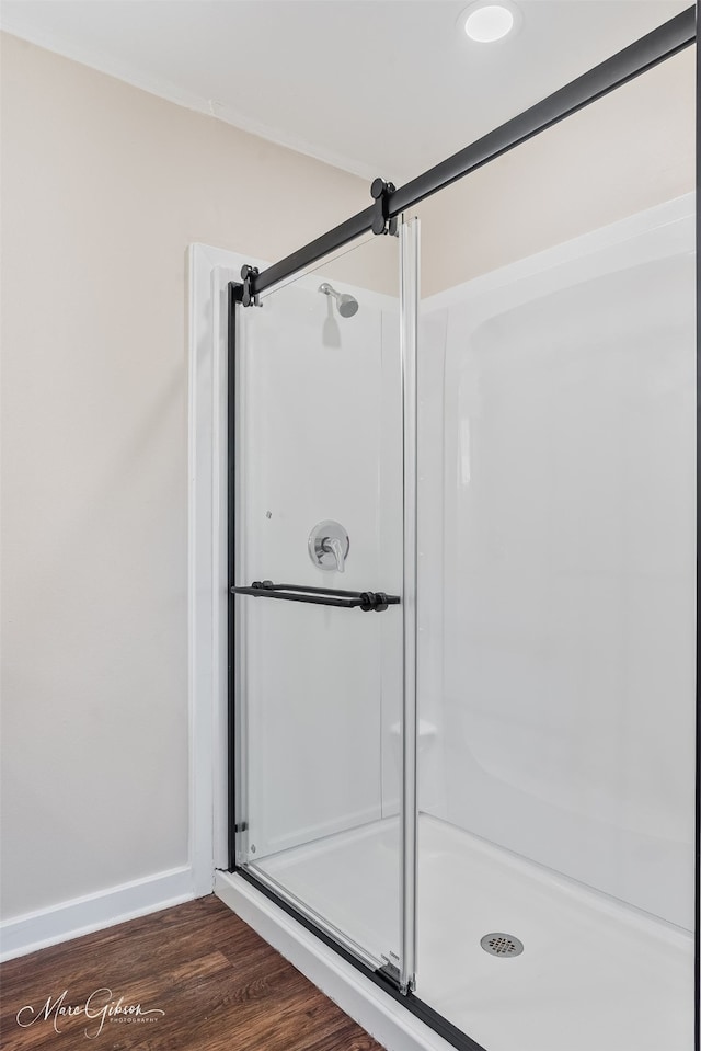 813 Dalzell St, Shreveport, LA 71104 - full bathroom featuring wood finished floors and a shower stall