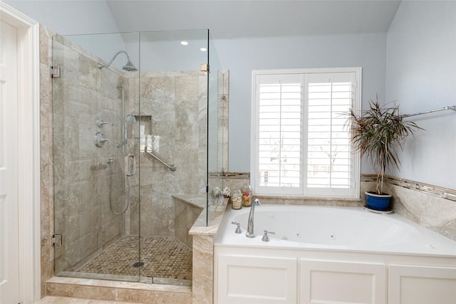 bathroom with a tub with jets and a shower stall