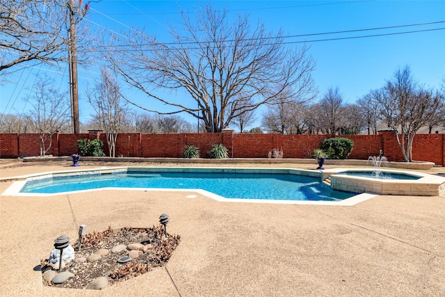 view of pool with a patio, a fenced backyard, and a pool with connected hot tub