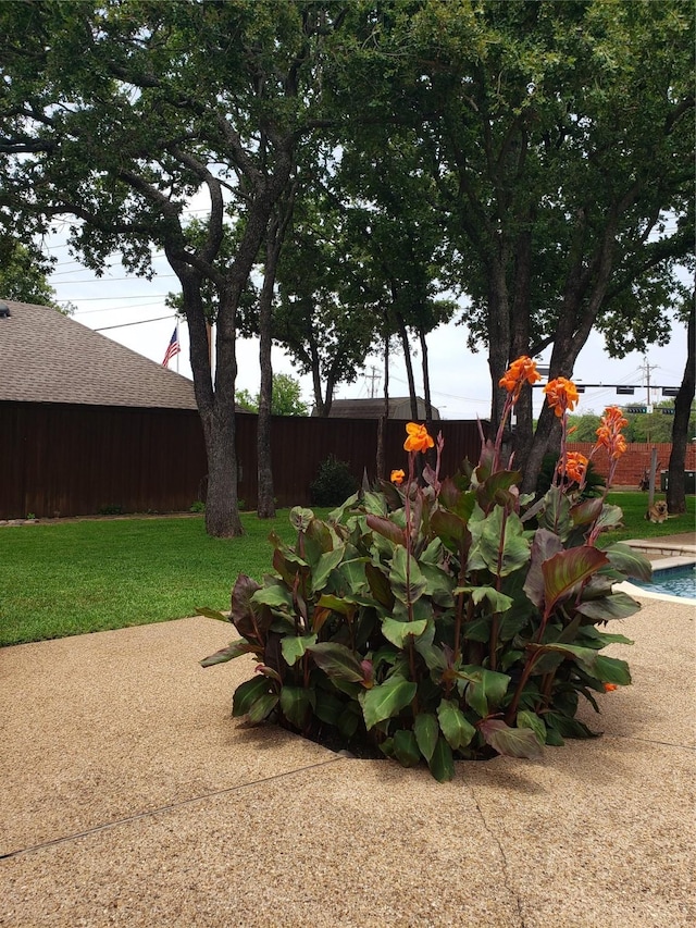 view of yard with a patio and fence