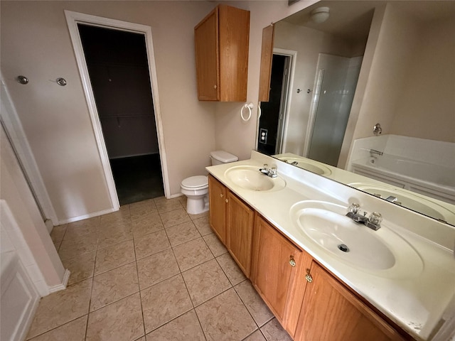 full bathroom featuring a shower stall, double vanity, and a sink