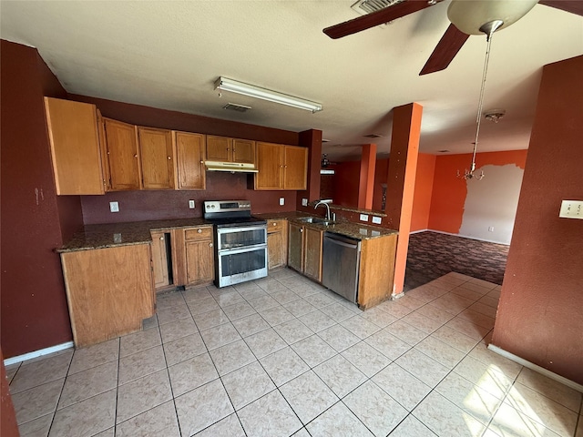 kitchen with visible vents, a sink, stainless steel appliances, under cabinet range hood, and brown cabinets