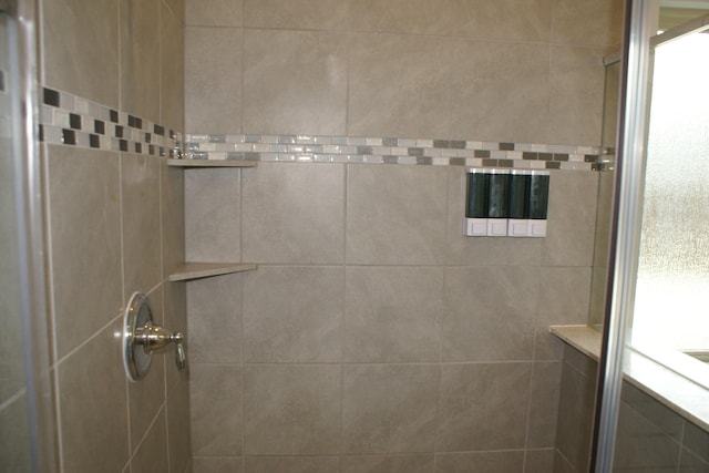 full bathroom with tiled shower