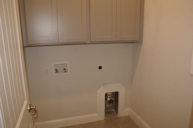 laundry area with cabinet space, electric dryer hookup, baseboards, and washer hookup