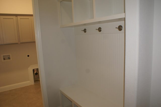 mudroom featuring baseboards and light tile patterned flooring