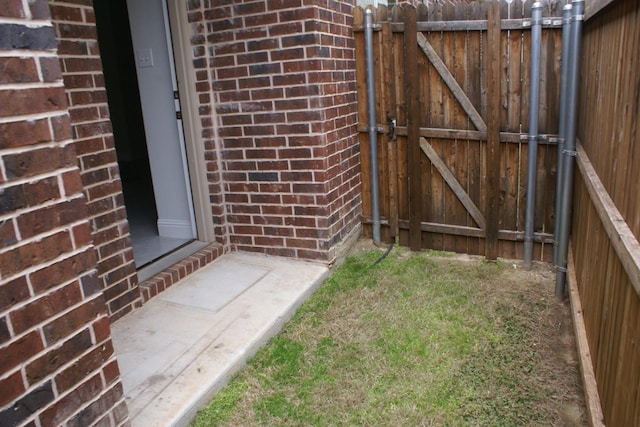 view of gate with fence