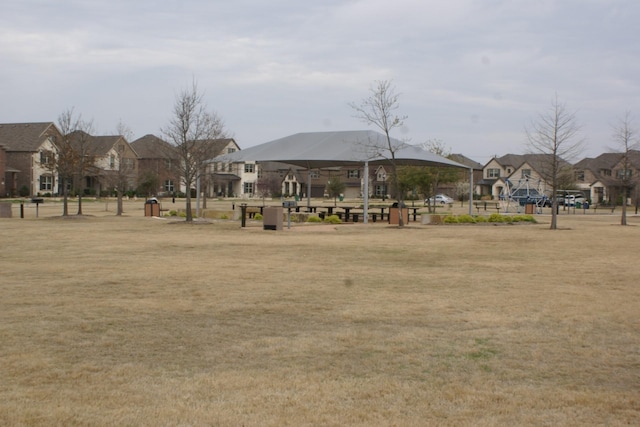 view of community featuring a yard and a residential view