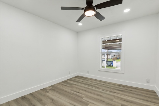 empty room featuring recessed lighting, light wood-style floors, baseboards, and ceiling fan