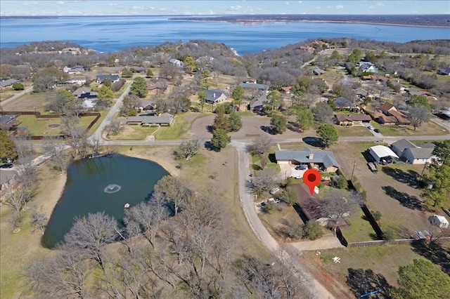 bird's eye view featuring a residential view and a water view