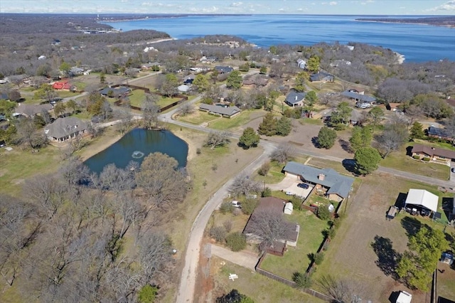 birds eye view of property featuring a residential view and a water view