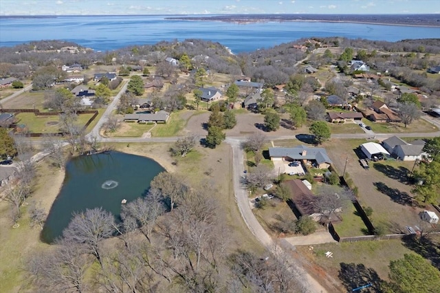 bird's eye view with a residential view and a water view