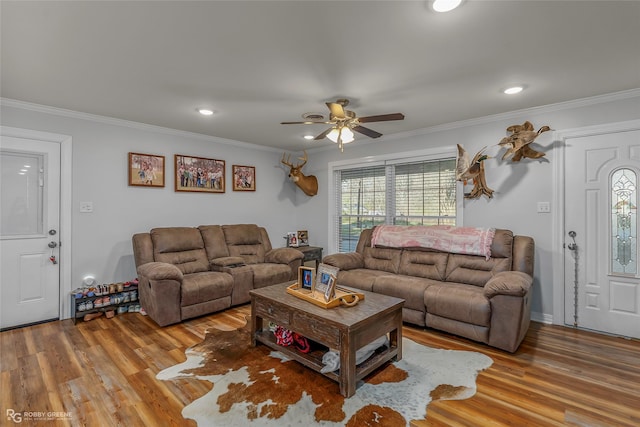 living room featuring recessed lighting, wood finished floors, ornamental molding, and a ceiling fan