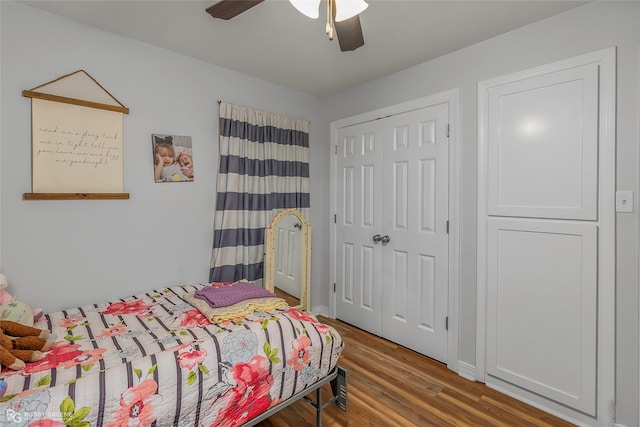 bedroom with a closet, a ceiling fan, and wood finished floors