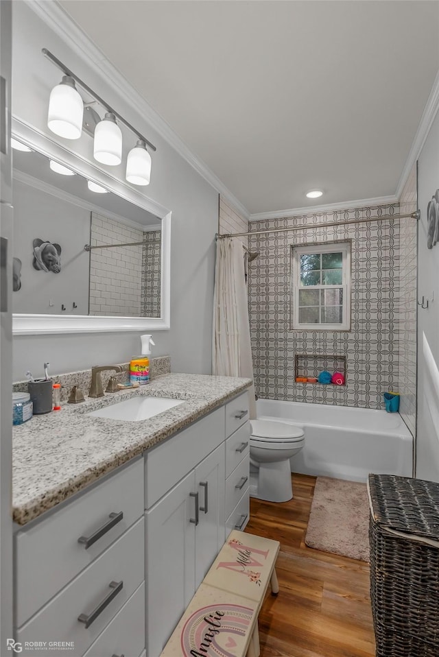 full bathroom with toilet, vanity, crown molding, and wood finished floors