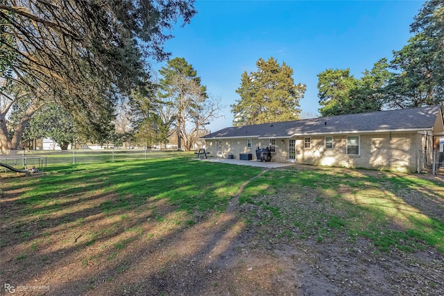 view of yard with a fenced backyard and a patio area