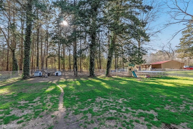 view of yard featuring a playground and a fenced backyard