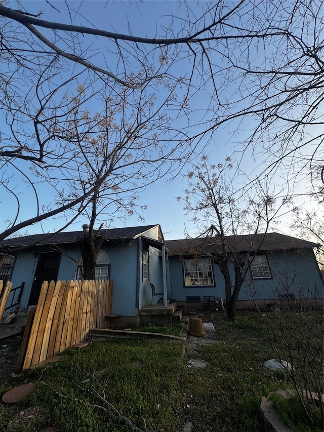 rear view of property with fence