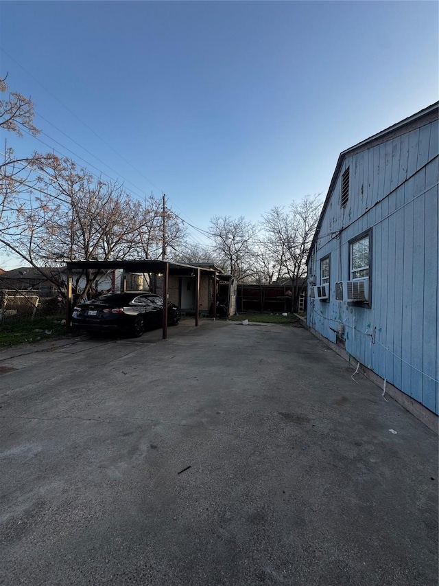 view of car parking featuring cooling unit and a carport