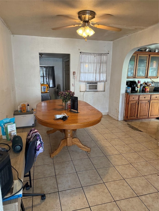 2208 Wagner Ave, Fort Worth, TX 76106 - dining room with light tile patterned flooring, arched walkways, and ceiling fan