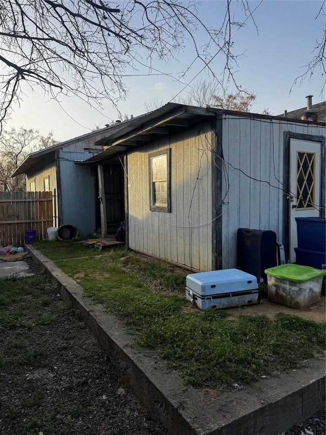 back of property with fence