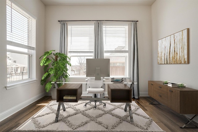 home office featuring baseboards and wood finished floors