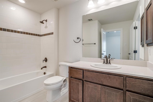 full bathroom with visible vents, washtub / shower combination, toilet, tile patterned floors, and vanity