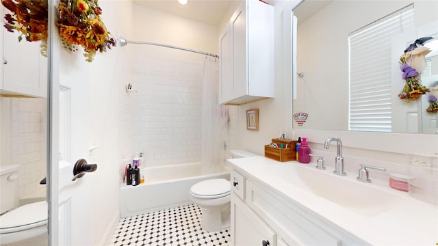 full bath featuring tile patterned floors, toilet, shower / tub combo with curtain, and vanity