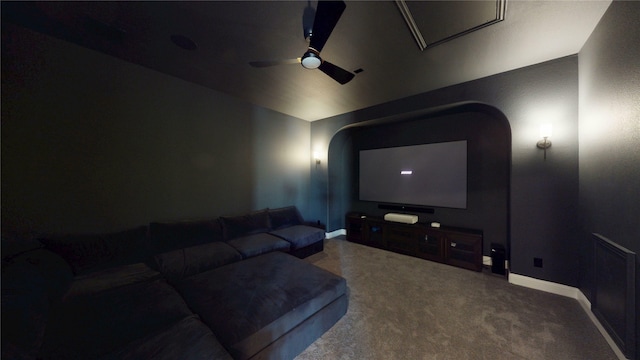 cinema featuring arched walkways, baseboards, and ceiling fan