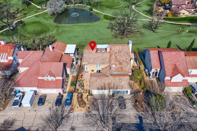 bird's eye view with a residential view, a water view, and view of golf course