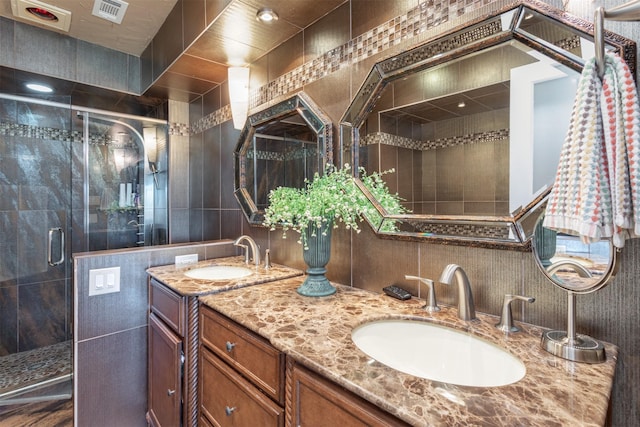 full bath featuring a sink, visible vents, and a stall shower