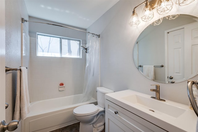 bathroom with shower / bathtub combination with curtain, toilet, and vanity