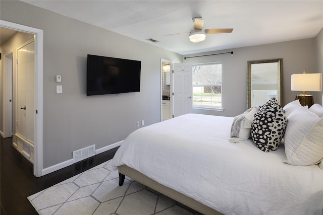 bedroom featuring wood finished floors, baseboards, visible vents, and ceiling fan