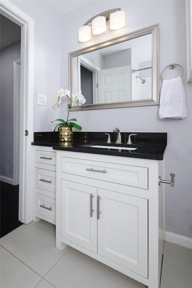 bathroom featuring tile patterned floors and vanity