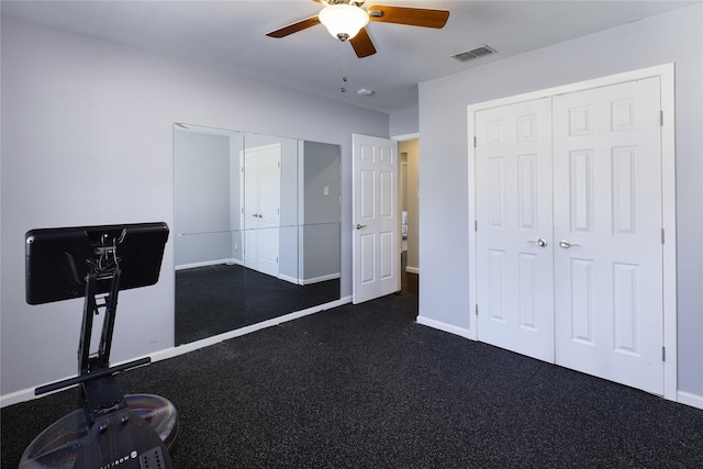 exercise area featuring baseboards, visible vents, and ceiling fan