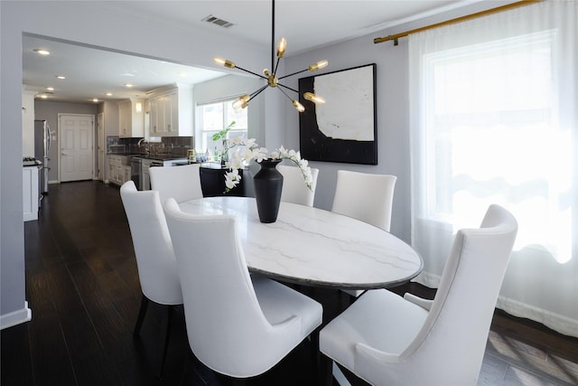 dining room featuring baseboards, visible vents, recessed lighting, dark wood-type flooring, and a notable chandelier